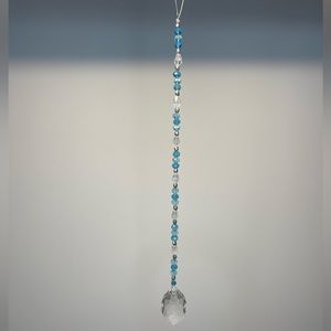 Blue, clear and silver sun catcher with glass prism